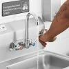 Regency Plumbing & Hardware Regency Wall Mount Handsink Faucet With 3 1/2" Swivel Gooseneck Spout, 4" Centers, And Wrist Handles